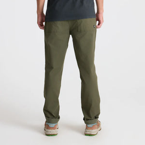 Person wearing Roark Layover Pro Traveler Pants in Military on a white background
