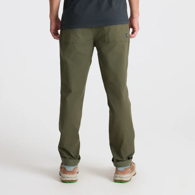 Person wearing Roark Layover Pro Traveler Pants in Military on a white background
