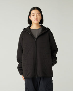 Person wearing a Snow Peak Flexible Insulated Zip Up Hoodie in Black on a plain background