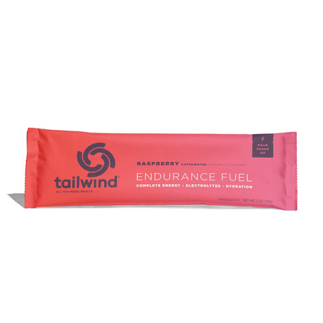 Tailwind Nutrition Endurance Fuel in Raspberry (caffeinated) on a neutral background.