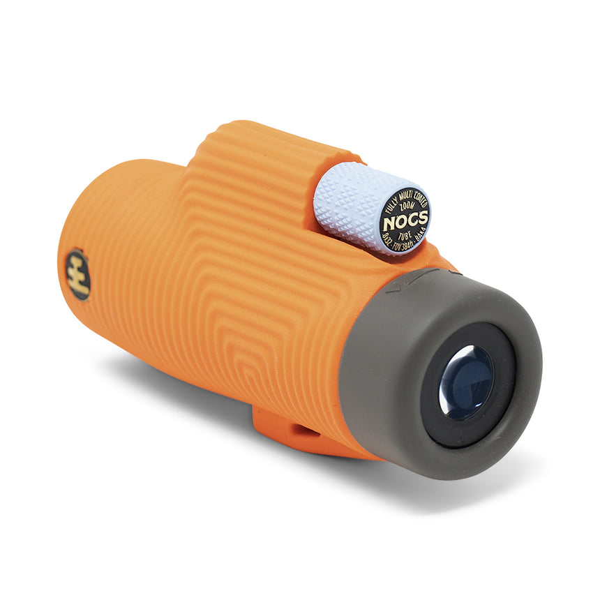 Nocs Provisions Zoom Tube 8x32 Monocular in International Orange on a neutral background at an angle.