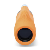 Nocs Provisions Zoom Tube 8x32 Monocular in International Orange on a neutral background showing the lens.