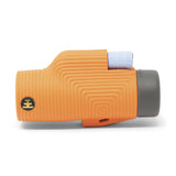 Nocs Provisions Zoom Tube 8x32 Monocular in International Orange on a neutral background from the side.