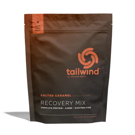 Tailwind Nutrition Recovery Mix in Salted Caramel on a neutral background.