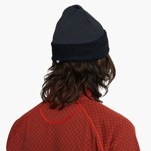 Person wearing a ciele UHBeanie fleece running beanie in Shadowcast on a white background