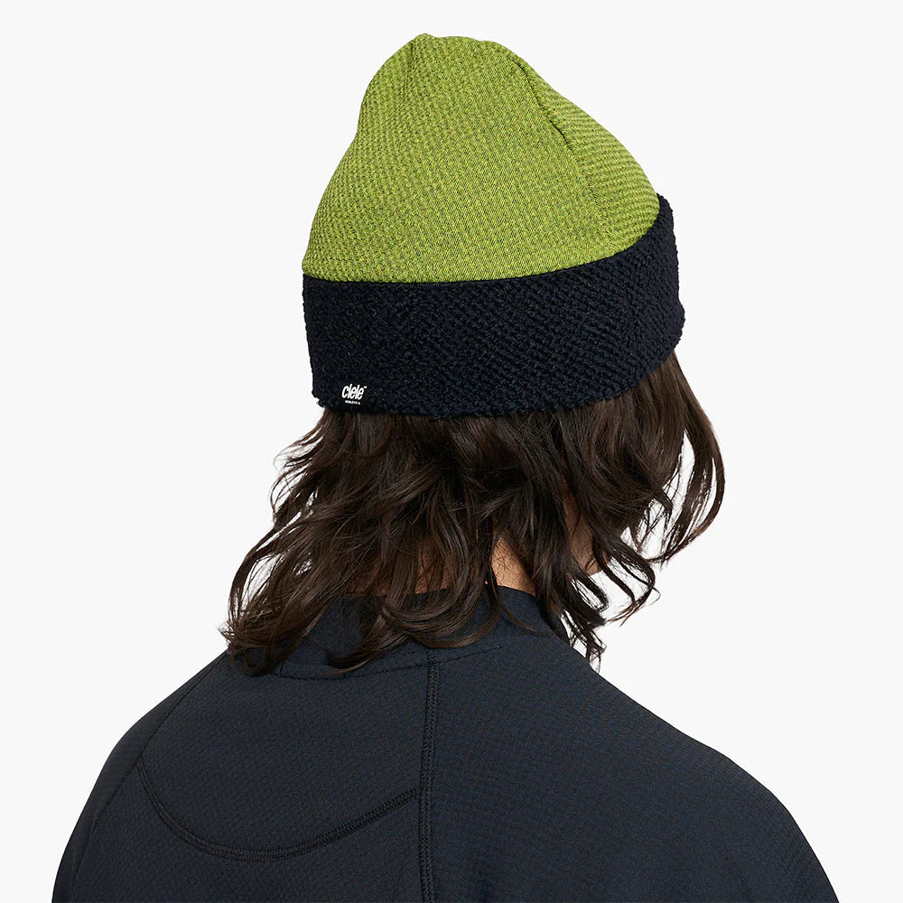ciele UHBeanie fleece running beanie in Lime Green worn by a person on a white background
