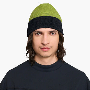 Person wearing a ciele UHBeanie fleece running beanie in Lime Green on a white background