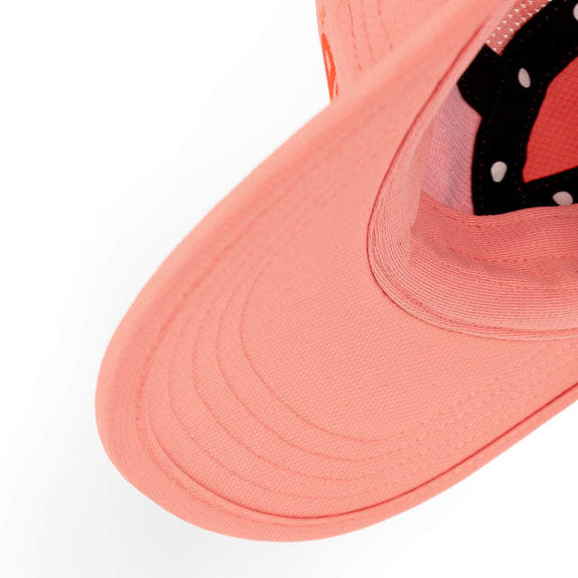 Close-up of a Ciele Athletics GOCap Classic - Athletics Blossom Coral running cap on a white background