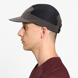 Person wearing a Ciele Athletics GOCap Icon - Circle C in Shadowcast performance running hat on a white background