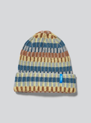 Janji Off-Grid Plaited Beanie in Dune on a neutral background.