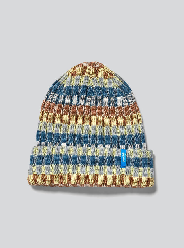 Janji Off-Grid Plaited Beanie in Dune on a neutral background.