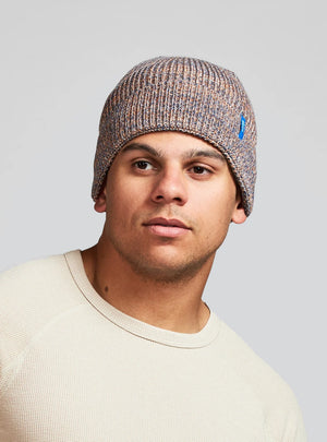 Janji Threshold Melange Beanie in Thunder Flare worn by a man on a neutral background.