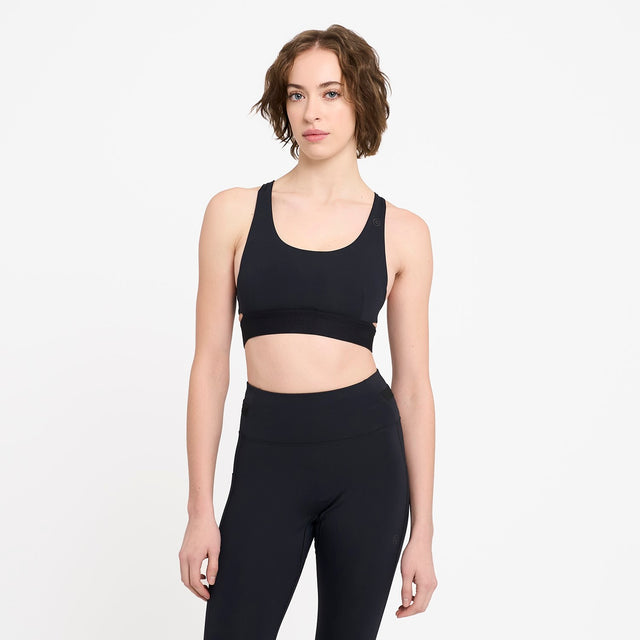 Ciele Athletics W QCKBra women's running bra in Shadowcast worn by a woman on a neutral background.