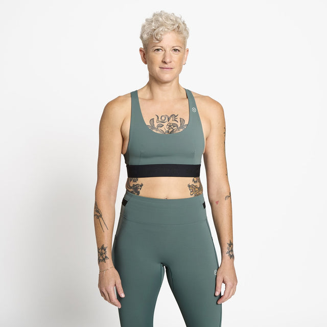 Ciele Athletics W QCKBra women's running bra in Silver Pine worn by a woman on a neutral background.