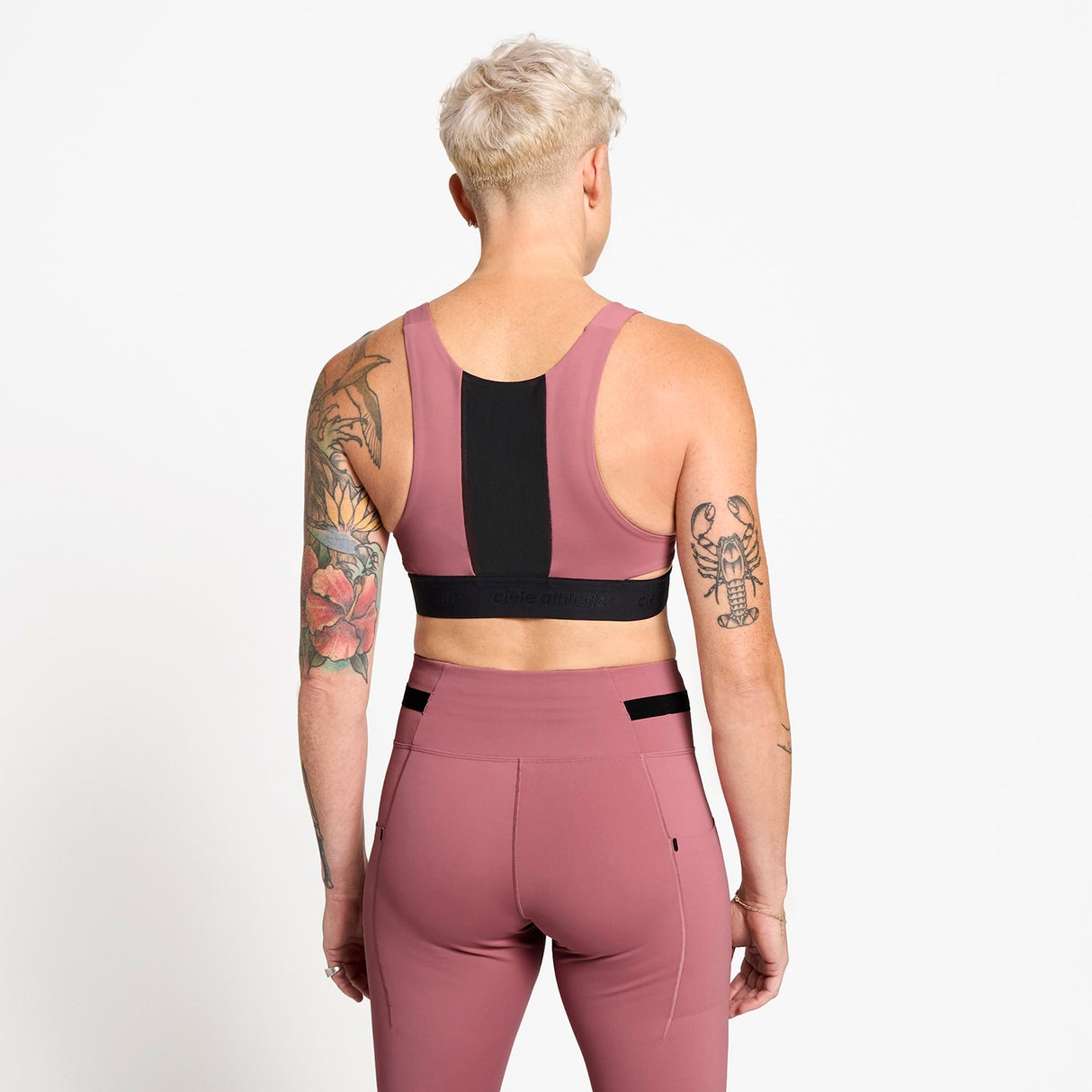 Ciele Athletics W QCKBra women's running bra in Deco Rose worn by a woman on a neutral background.