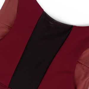 Close-up of a Ciele Athletics Women's QCKBra Sports Bra in Crimson Red Maroon sports bra with a black back vent on a white background