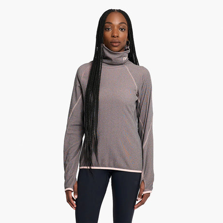 Woman wearing a Ciele Athletics Women's IBTHoody - Fleece Running Hoodie in Peachskin on a white background
