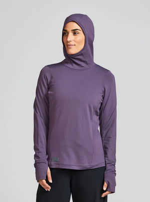 Janji W's Rover Merino Hoodie for women in Massif worn by a woman on a neutral background.