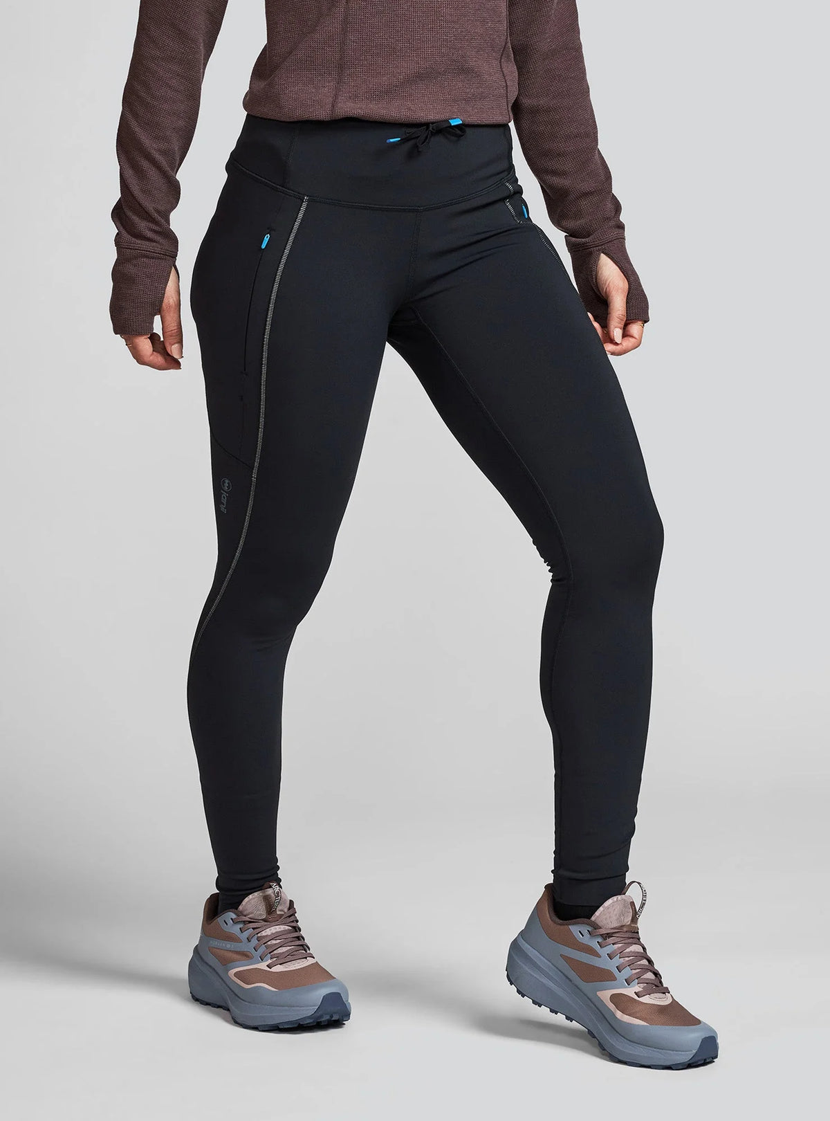 Janji women's Aurora Fleece Tight worn by a woman on a neutral background.