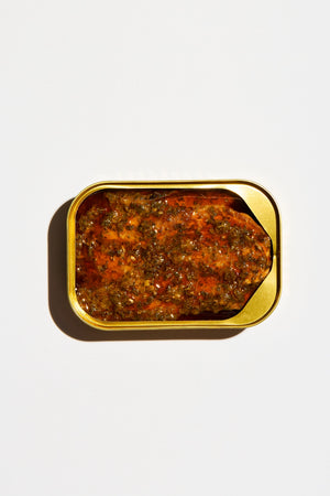 Fishwife Smoked Rainbow Trout with Red Chimichurri with gold tin on a white background