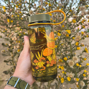 Mustard Beetle Toad & Mushrooms, 16oz Wide Mouth Nalgene Water Bottle outdoors.