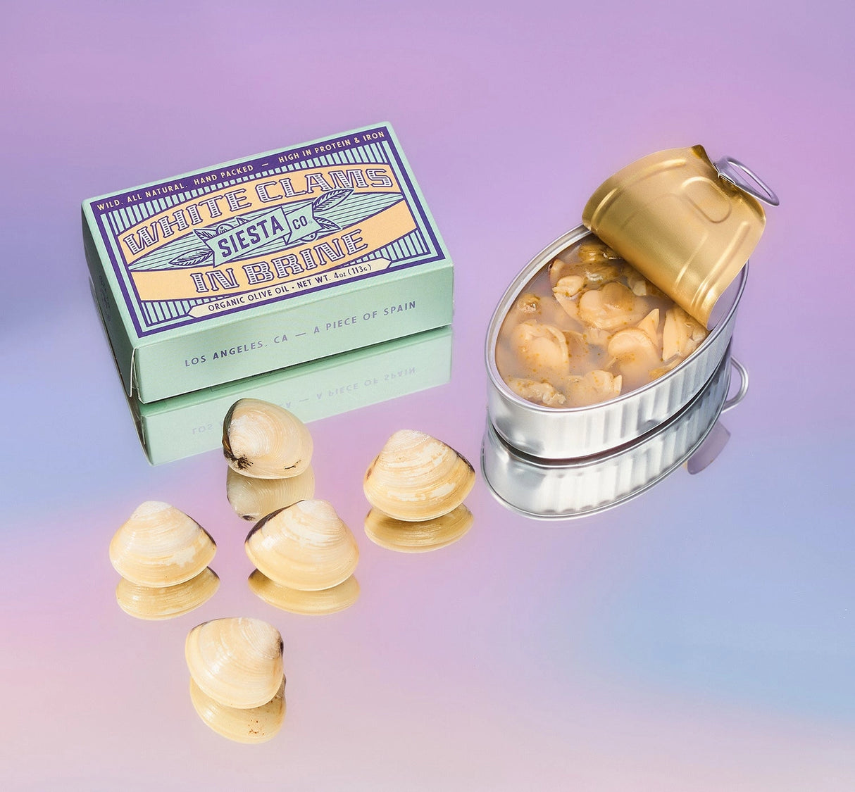 Siesta Co. White Clams in Brine with shell-shaped objects and packaging on a gradient background