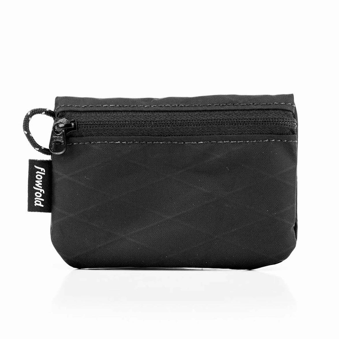 Flowfold Essentialist Mini Zip Pouch in black on a neutral background.