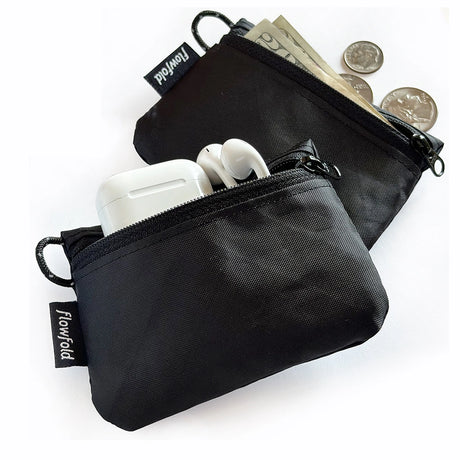 Flowfold Essentialist Mini Zip Pouch in black on a neutral background showing its capacity.
