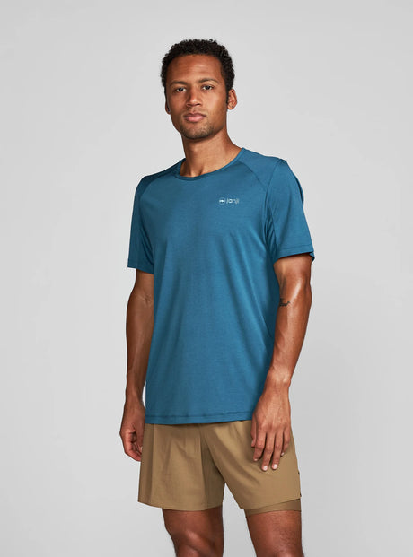 Janji Run All Day Tee on a neutral background being worn by a man.