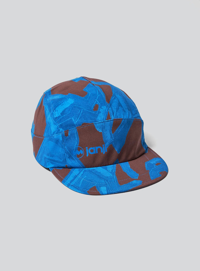 The Janji AFO Hyperlight Cap in Cobalt Horses on a neutral background.