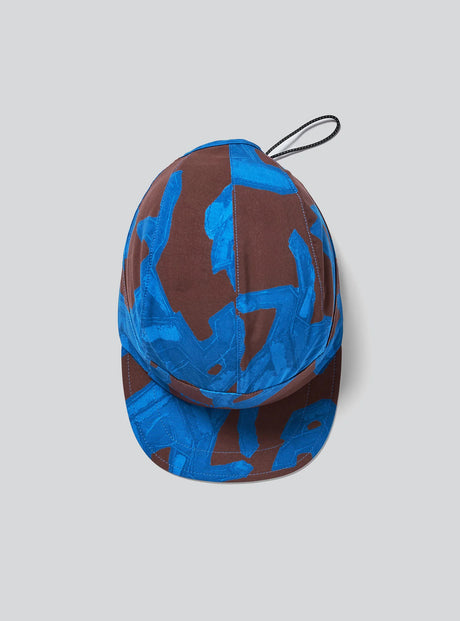 The Janji AFO Hyperlight Cap in Cobalt Horses on a neutral background.