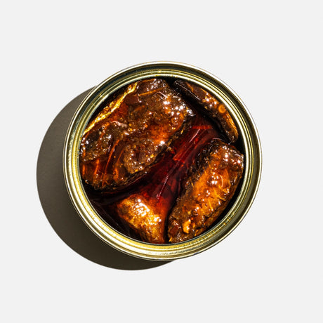 Fishwife Smoked Salmon with Sweet & Spicy Zhong tinned fish contents on a neutral background.