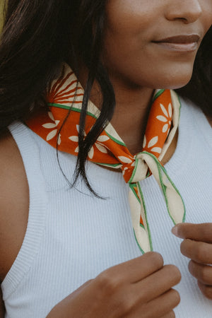 Bandits La Magia De Tochtli Bandana worn by a woman outdoors.