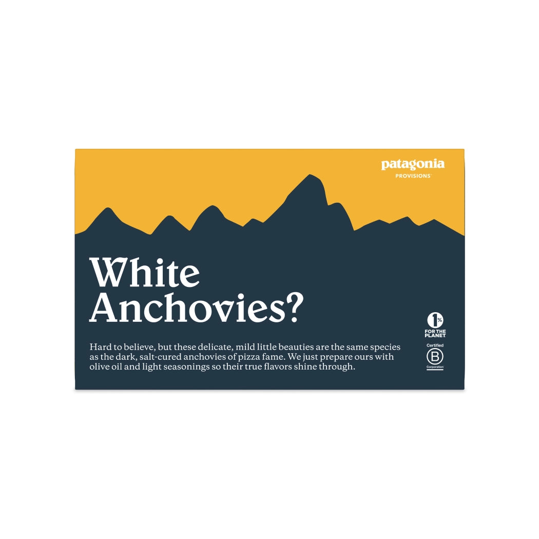 Patagonia Roasted Garlic Spanish White Anchovies product packaging with mountain design and text about white anchovies.