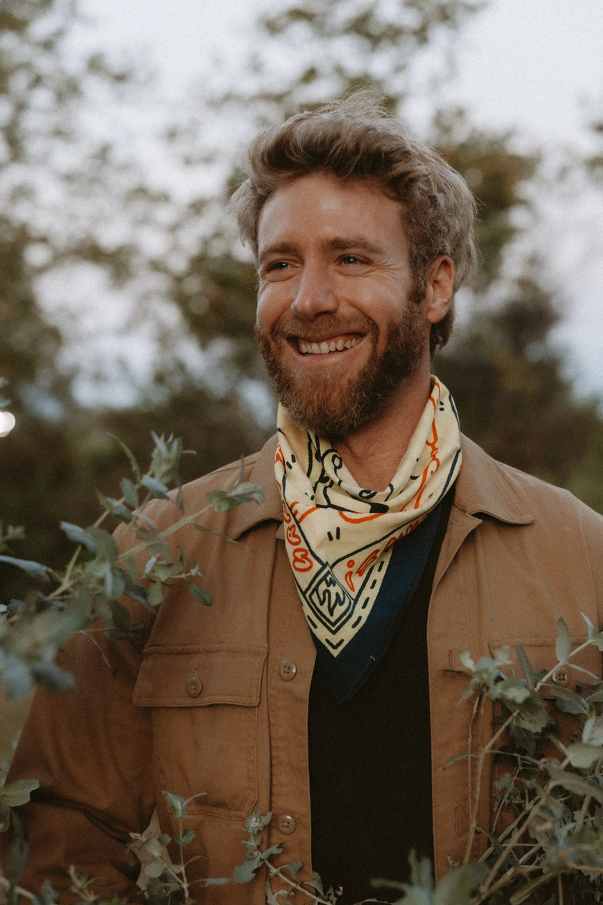 Bandits Grab The Horns bandana worn by a man outdoors.