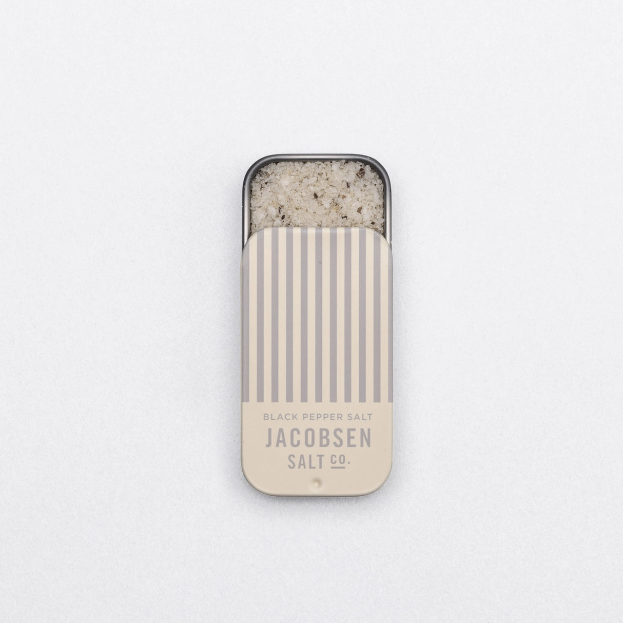 Jacobsen Salt Co. Infused Black Pepper Sea Salt Slide Tin on a white background