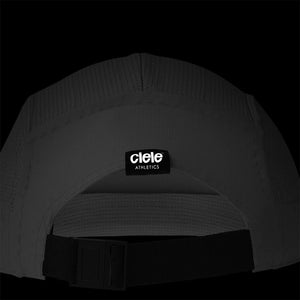 Ciele Athletics GOCap - Athletics in Ghost from the rear on a dark background to show the reflective detailing.