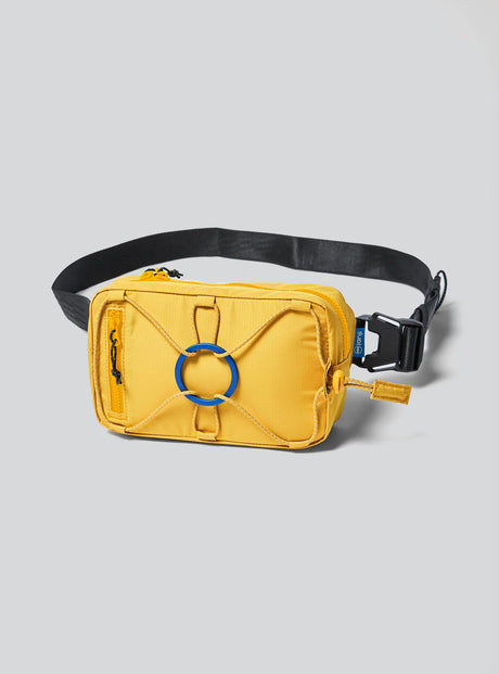 Janji Multipass Mini 1L running sling bag in Goldenray on a neutral background.