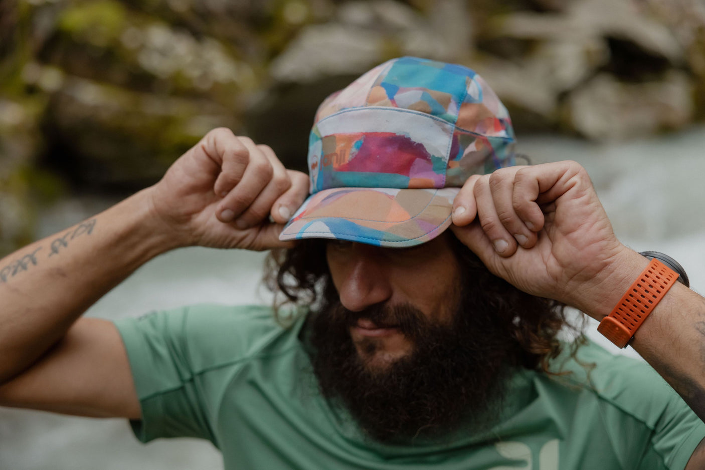 Janji AFO Hyperlight Cap worn by a man outdoors.