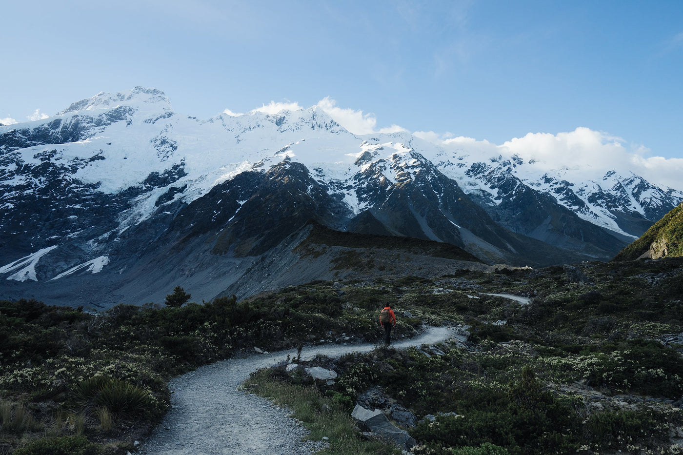 Hiker on a rugged mountain trail.