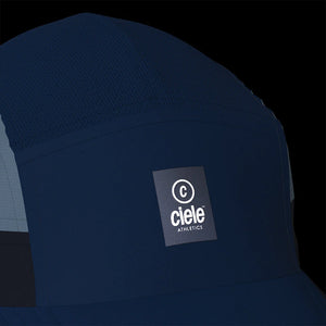 Ciele Athletics GOCap SC - C Plus Box in Indifar from the front on a dark background to show the reflective detailing.