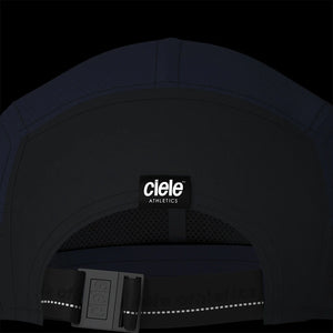 Ciele Athletics PBCap - C-Cube in Ironcast from the rear on a dark background showing the reflective detailing.