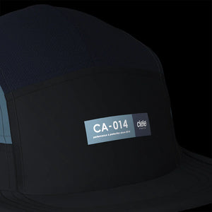 Ciele Athletics GOCap - Since in Ironcast from the front on a dark background to show the reflective detailing.