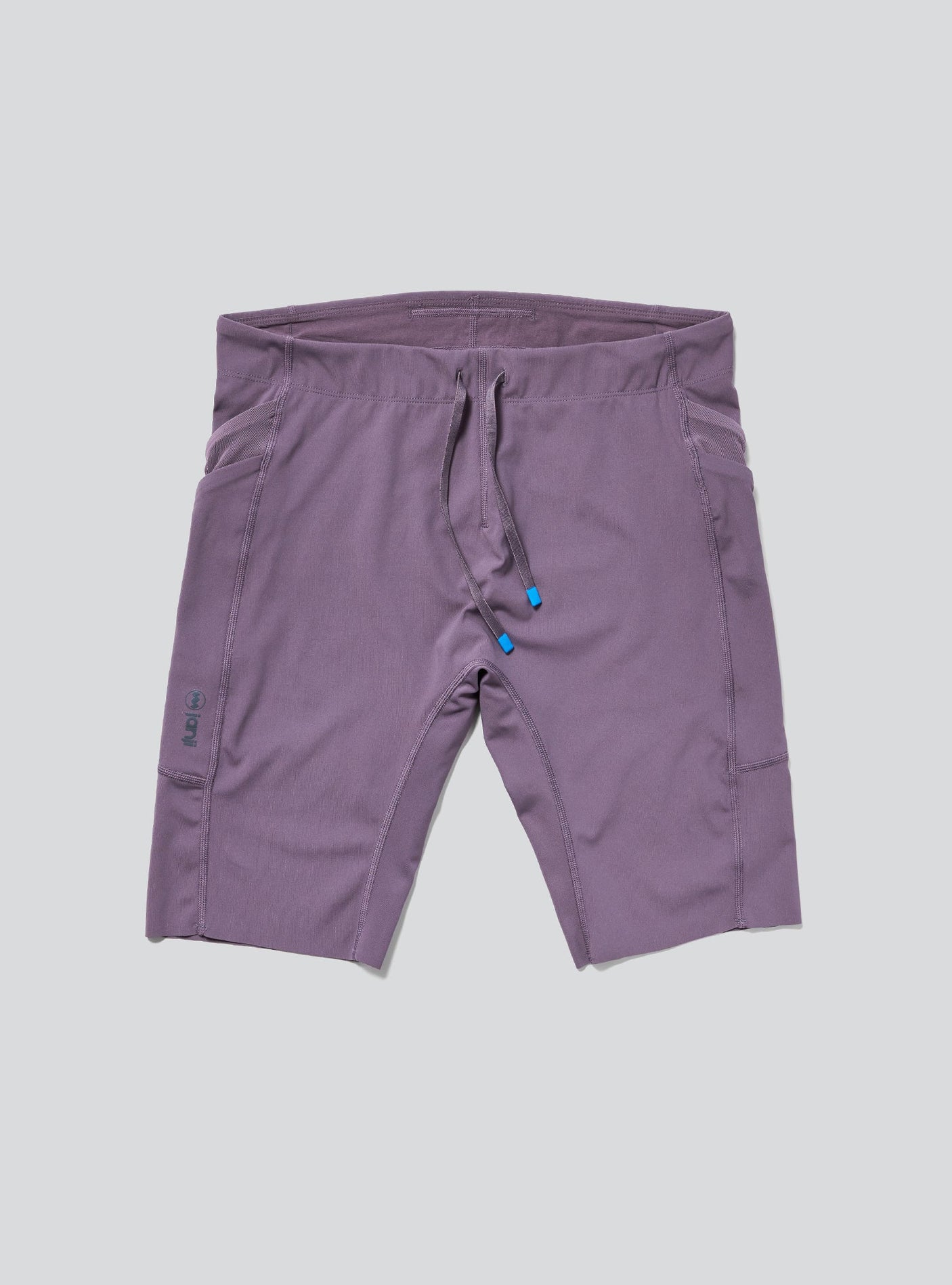 Janji Men's 8" Trail Half Tight in Massif on a neutral background.