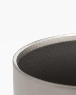 Close-up of a Snow Peak titanium Ti-Double 450 Mug  with a dark interior on a white background