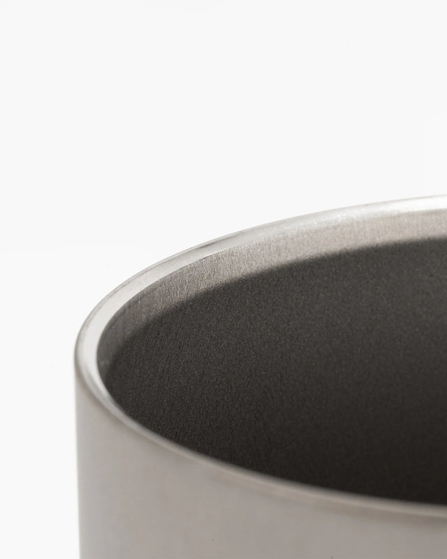 Close-up of a Snow Peak titanium Ti-Double 450 Mug  with a dark interior on a white background