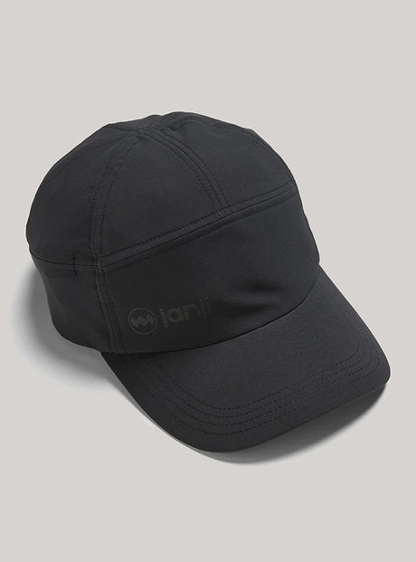 Janji's Transit Tech Cap in Midnight on a neutral background.