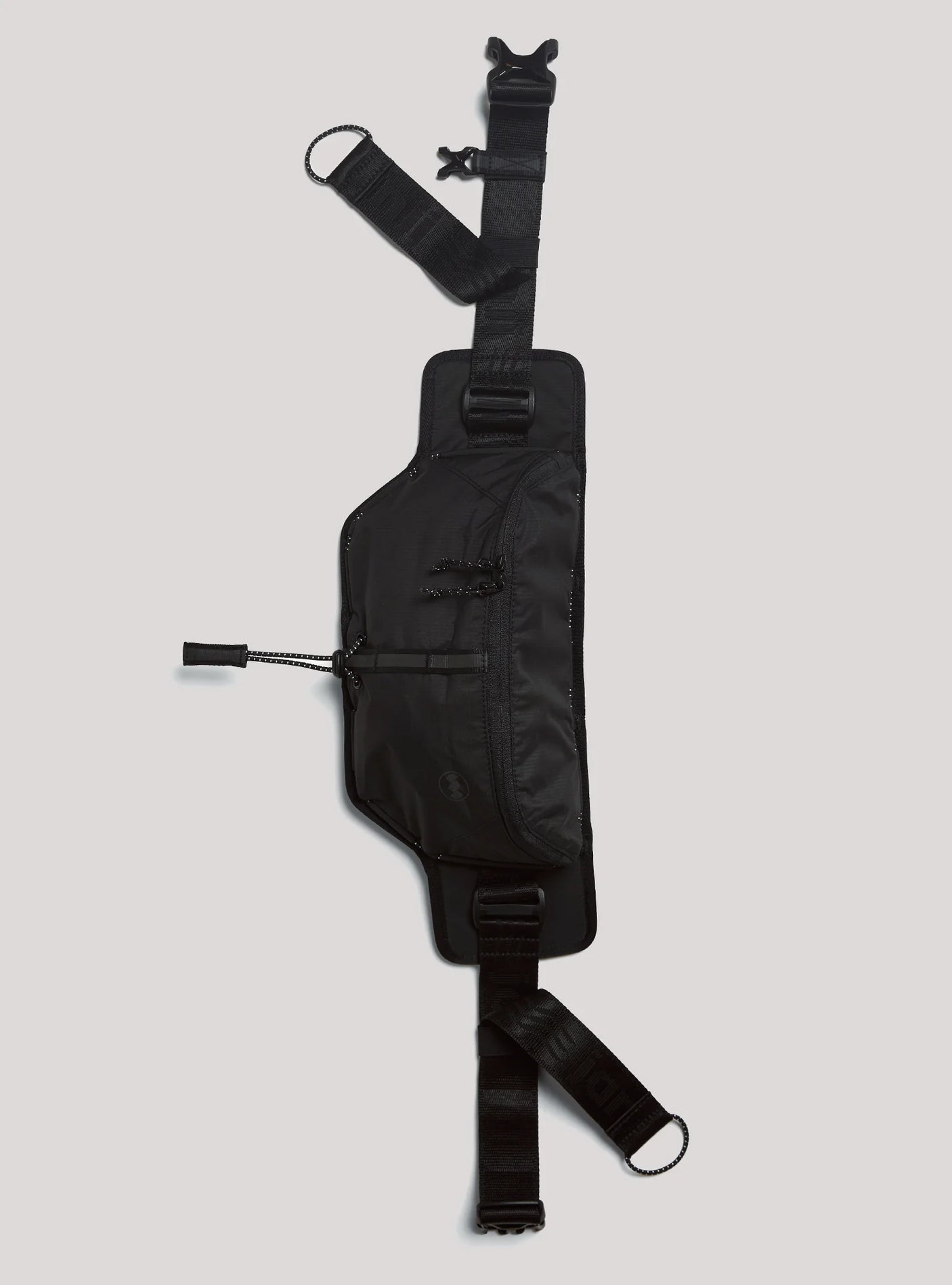 Janji Multipass Sling Bag on a neutral background.