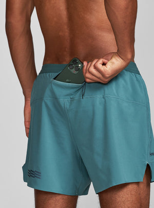 Janji's 5" AFO Middle Short Ultra in Plateau showing the rear waist pocket.