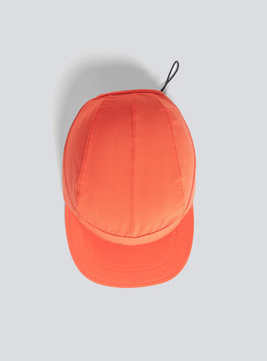 Janji AFO Hyperlight Cap in Poppy on a neutral background from above.